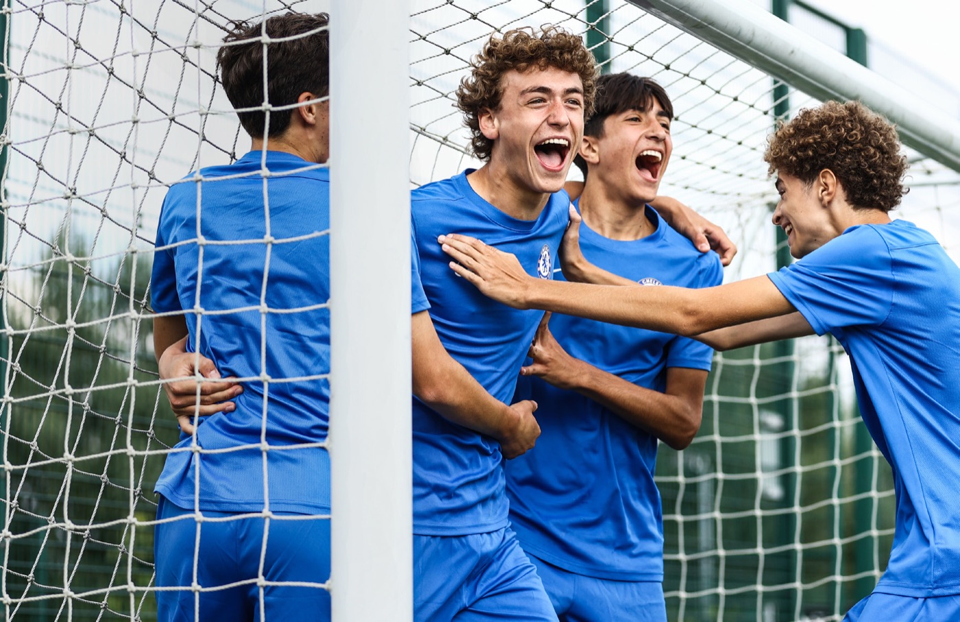 Chelsea FC camp players celebrating at the goal